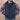 View of Filson Down Cruiser Vest in Dark Tan and Blue Coal featuring oil finish Cover Cloth and multiple pockets