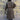 View of Filson Ladies Duster Coat in Marsh Olive featuring cape over shoulders, four front cargo pockets, and corduroy-lined collar