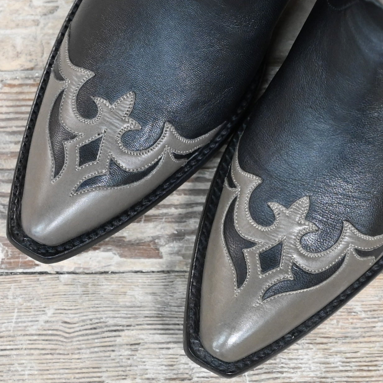 View of Stallion Ladies 11&quot; midnight hair-on boot with gray wingtip, foxing, and multicolor inlays