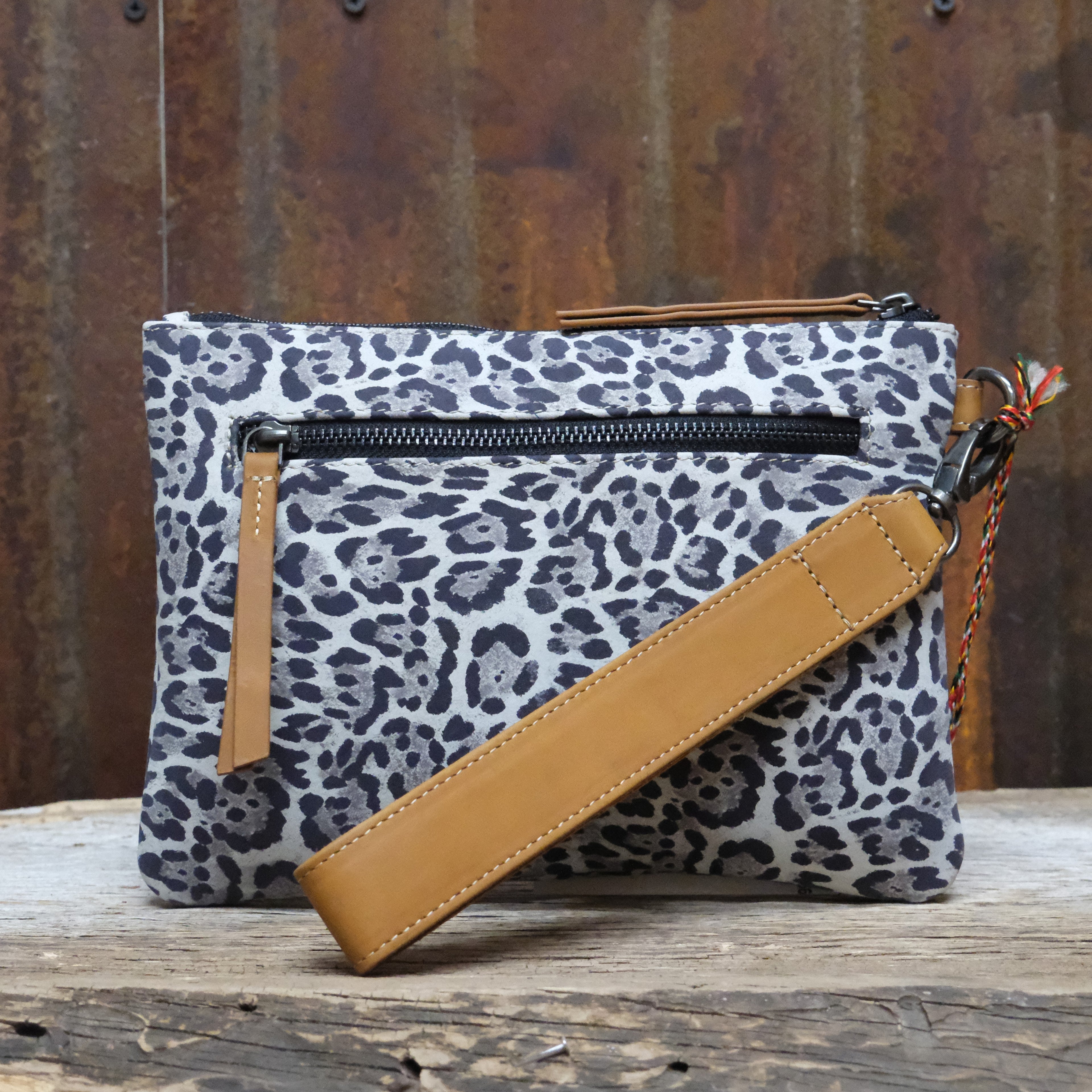 Myra Sable Trail dusty ivory printed canvas pouch bag with leather trim and zipper closure