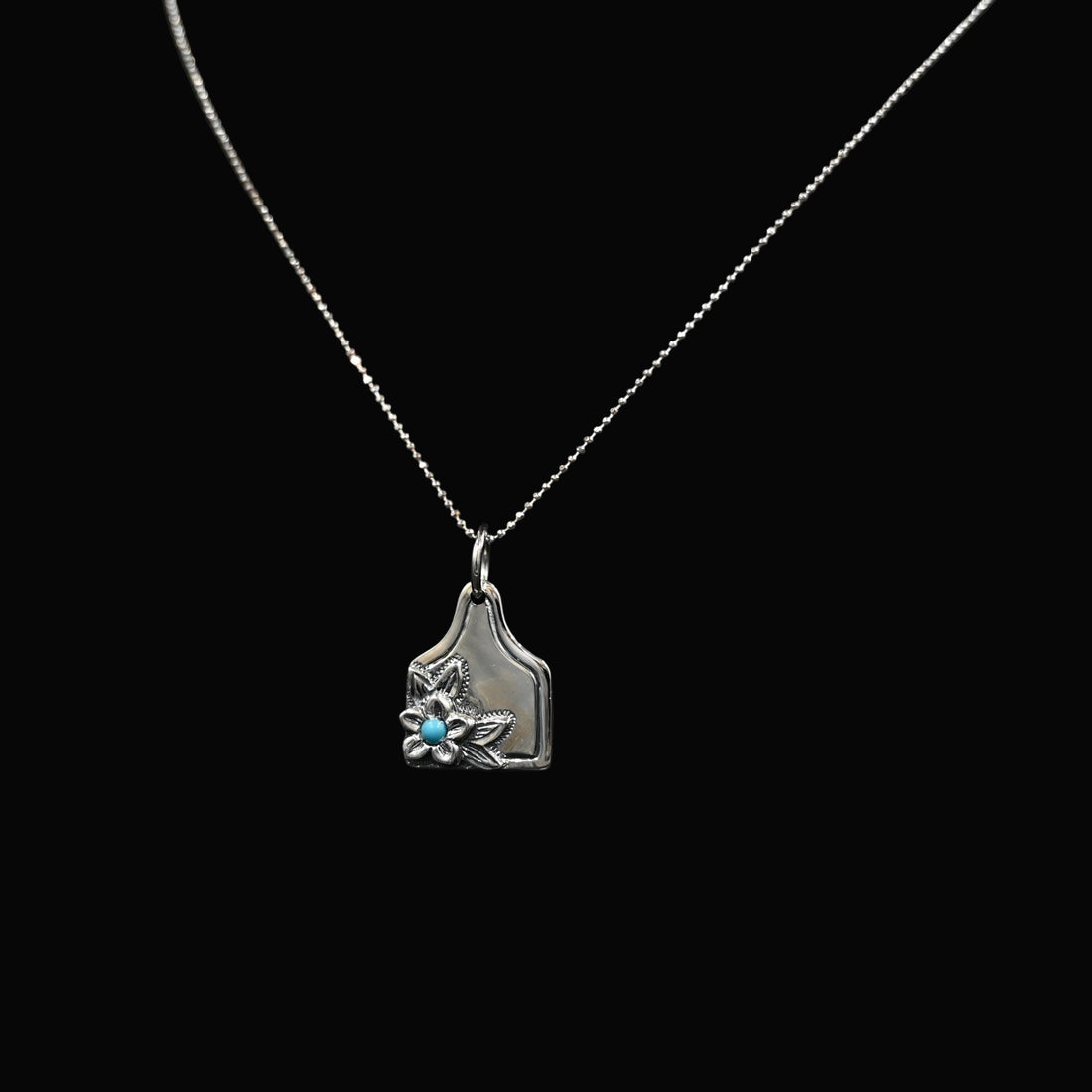 Vogt Turquoise Blossom eartag pendant in sterling silver with turquoise stone and floral motif