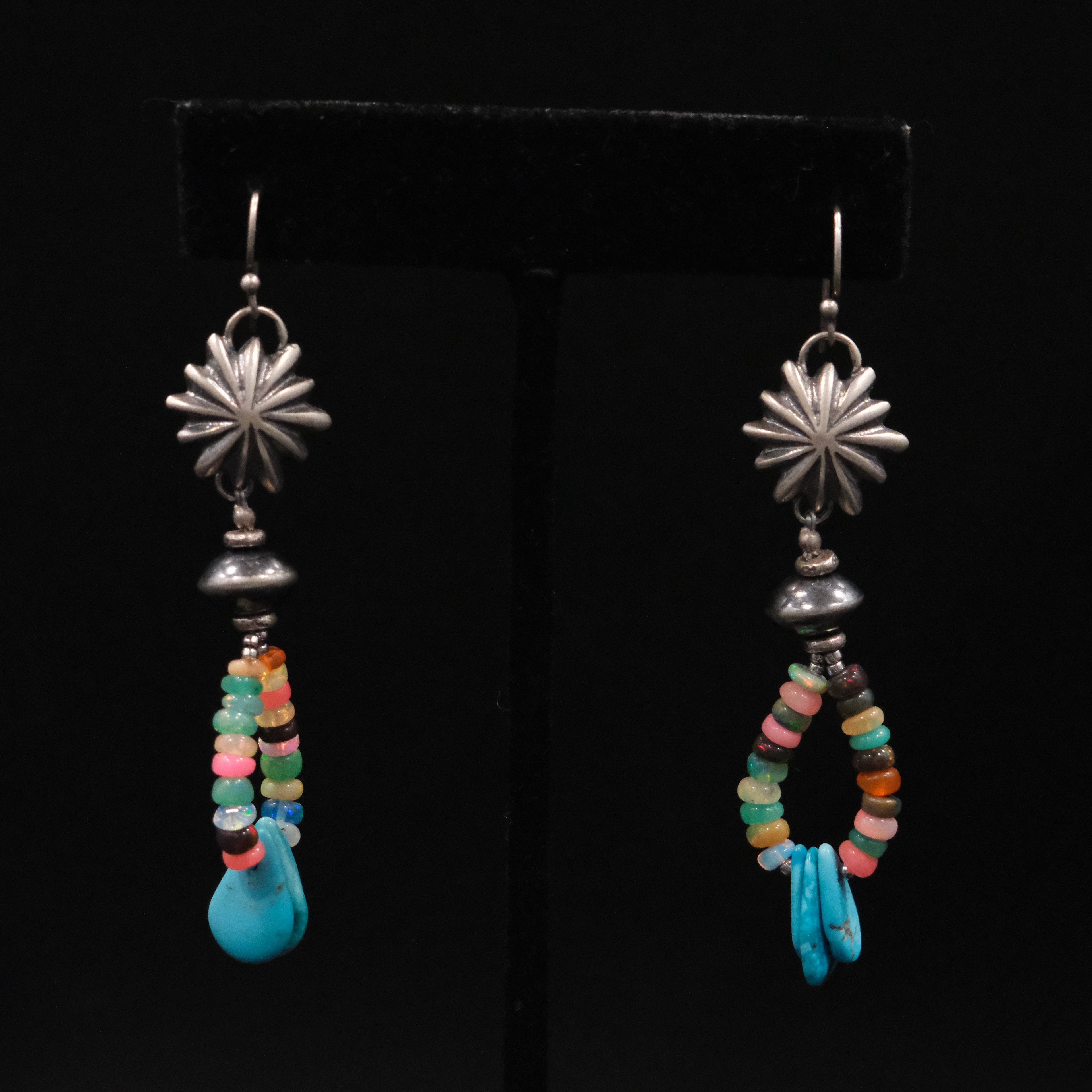 Peyote Bird Revival mixed stone and turquoise dangle earrings displayed on black background