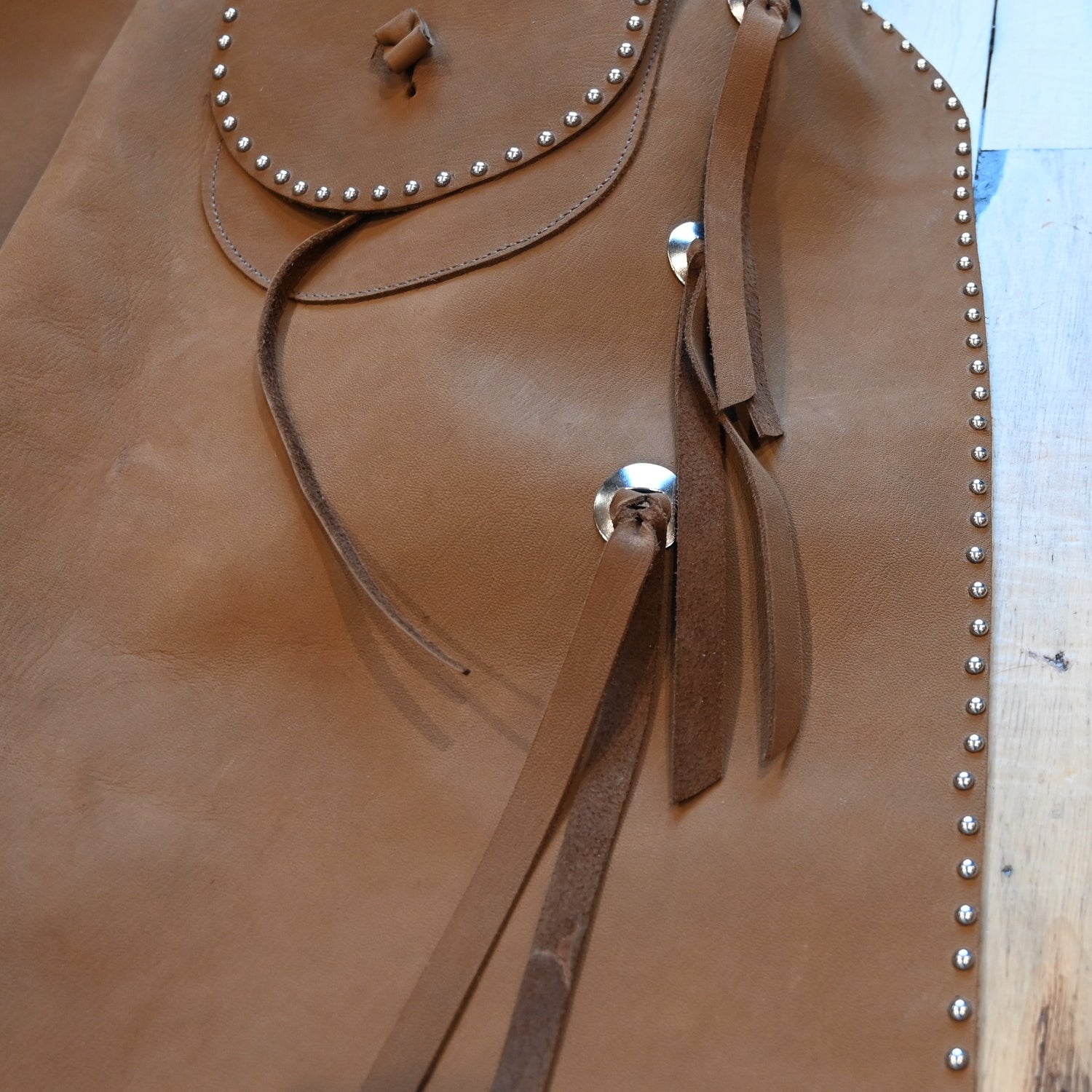 View of K Bar J Batwing Chap in size Medium with rivets and a pocket