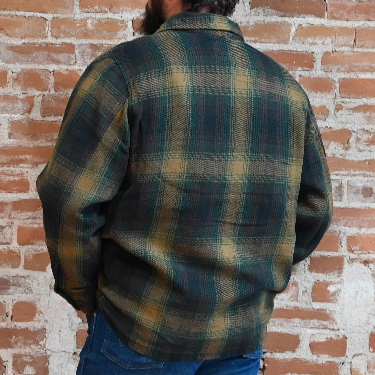 View of Filson Deer Island Ranch Coat in Navy/Red Multi Plaid and Dark Tan/Sycamore Plaid featuring button-front closure and patch pockets