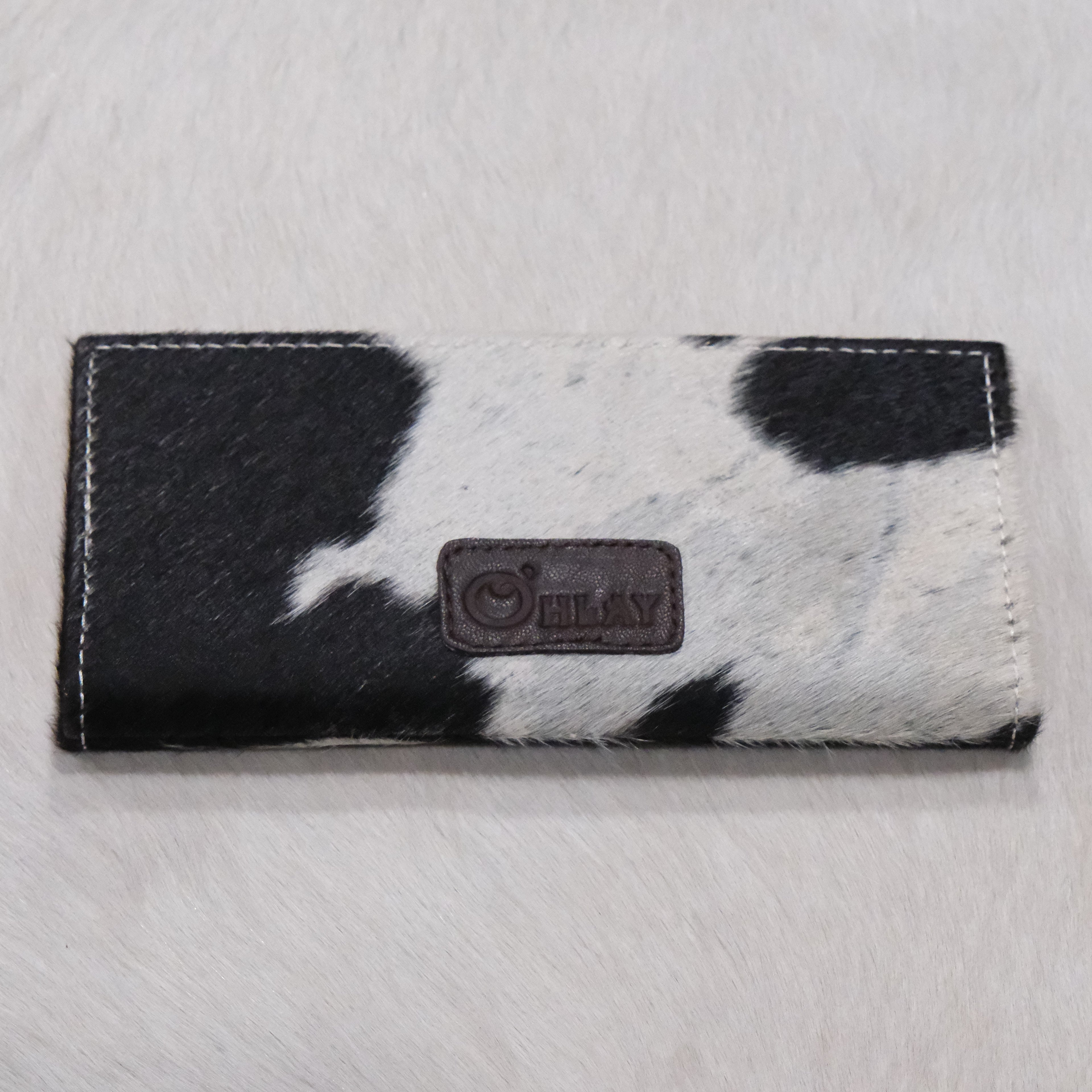 American Darling tooled leather checkbook wallet with hair-on hide and snap closure