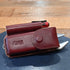 Martin harness leather case with flashlight, wrench, and Surge Leatherman tool combo