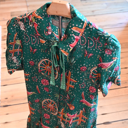 View of Double D Ranch Rhinestone Suits &amp; Cowboy Boots Dress featuring custom Western print, faux-turquoise buttons, and pearl snaps in a relaxed fit