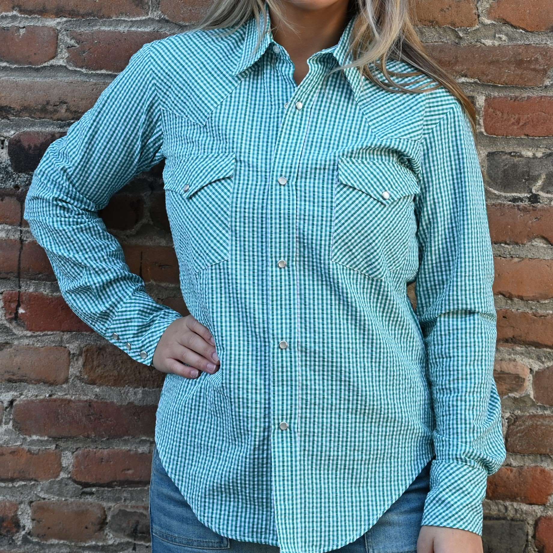 View of Blue Blanket ladies green plaid Western shirt with pearl snap buttons and tailored silhouette