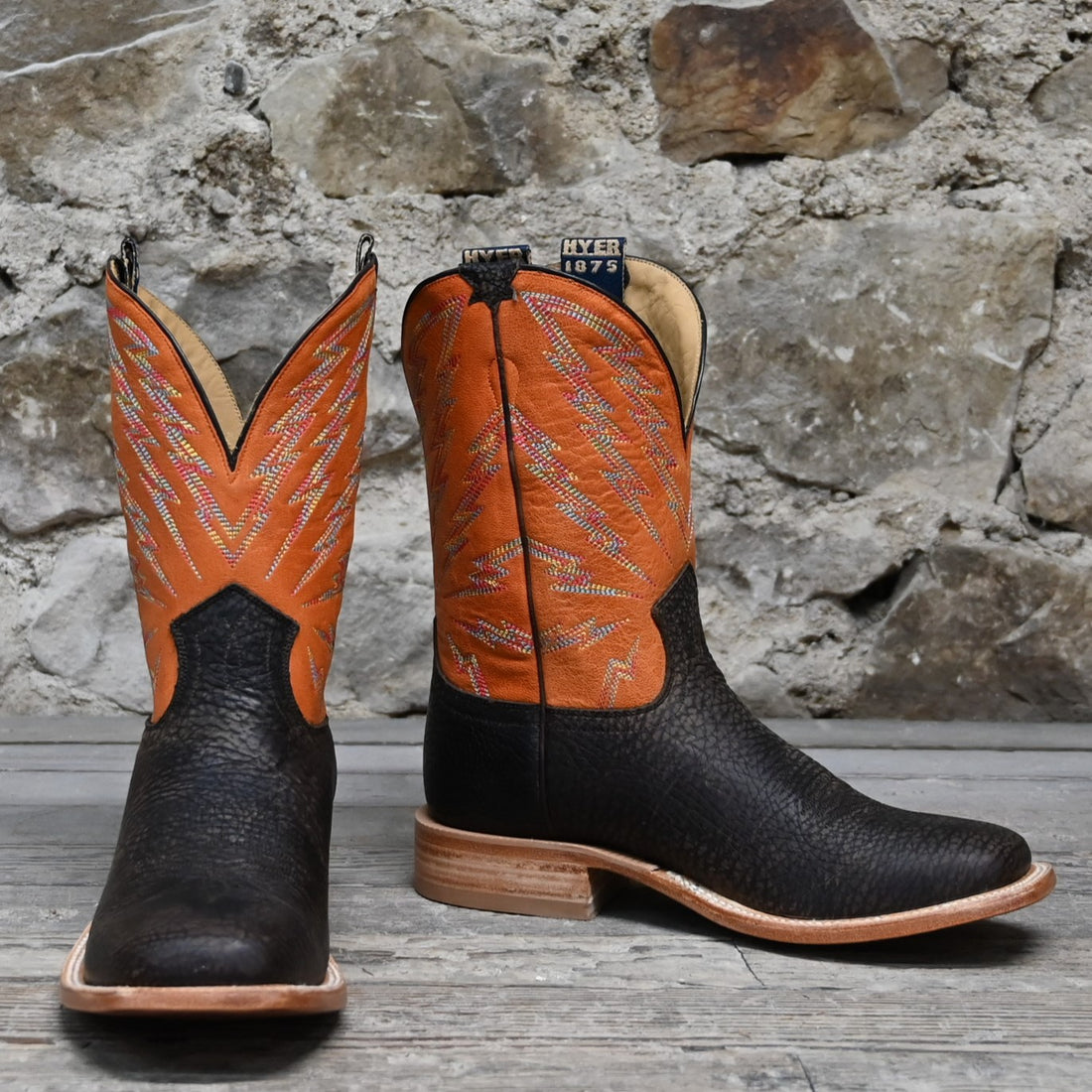 View of Hyer HAZELTON 11&quot; boots showcasing black Apache bullhide leather vamp and tangerine vintage goat upper with broad square toe and Stockman block heel