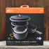 GSI Pinnacle Base Camper cookset with pots, pans, lids, plates, bowls, and mugs in a nested camp kitchen setup