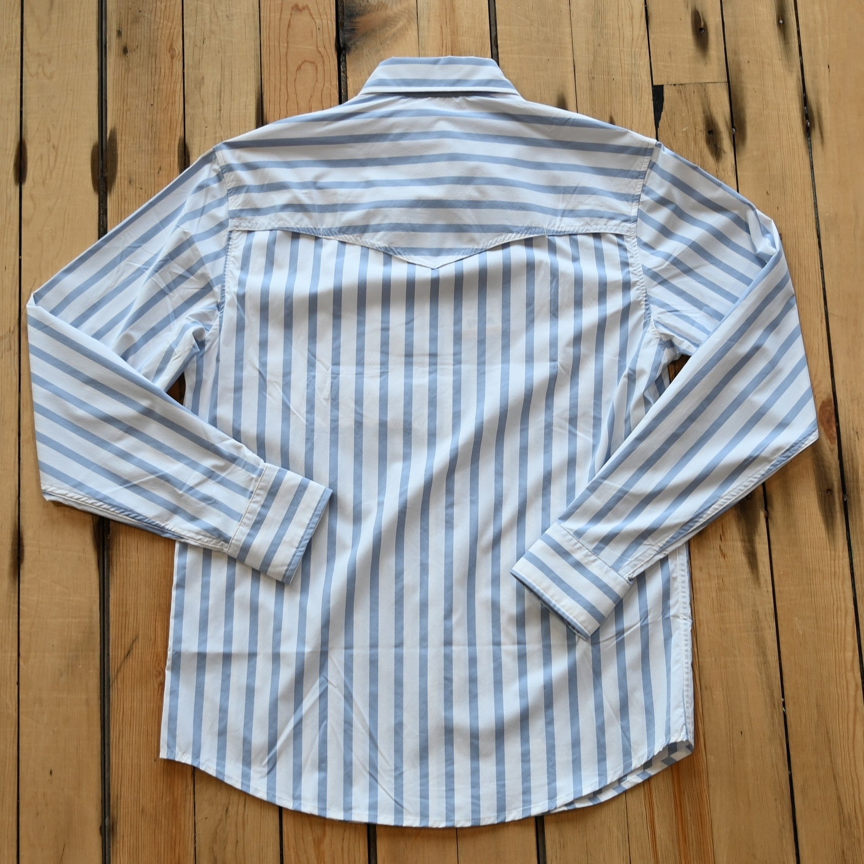 View of Schaefer blue stripe Western snap shirt with mesh-back vent and chest pockets