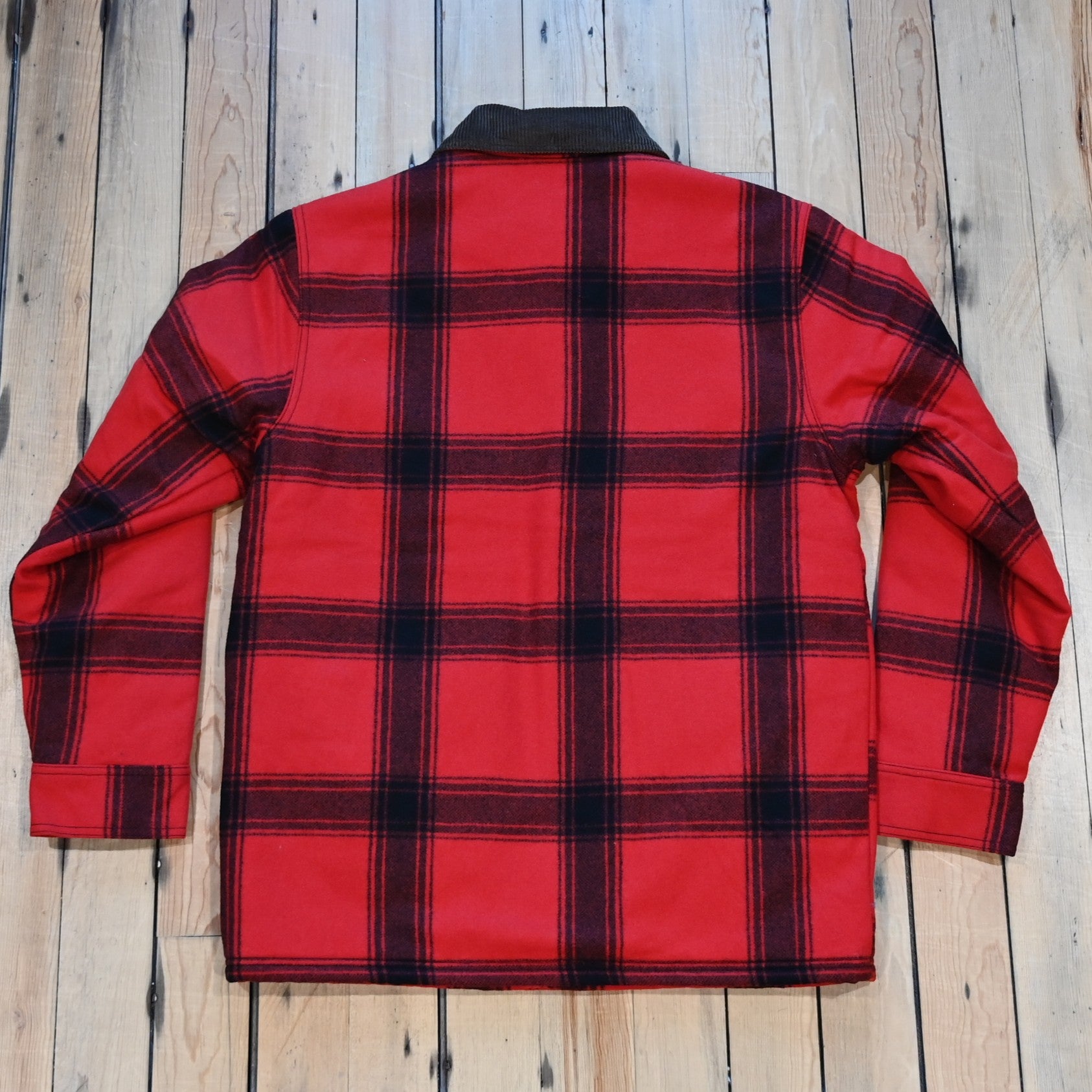 Filson Spokane Insulated Cruiser Jacket in red/black windowpane with snap front and flap pockets