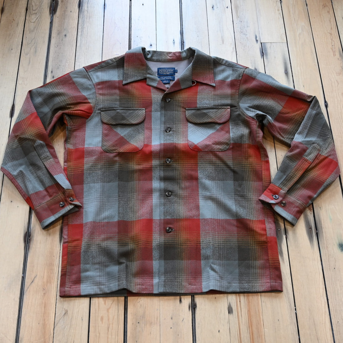 View of Pendleton men’s wool board shirt in tan red plaid with square hem and bias chest pockets