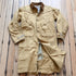View of Schaefer canvas duster in solid suntan with corduroy collar and full-length storm flap