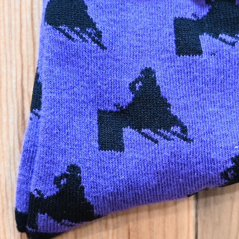 View of Austin Accent Kids Sock in purple with Barrell racer in black design.