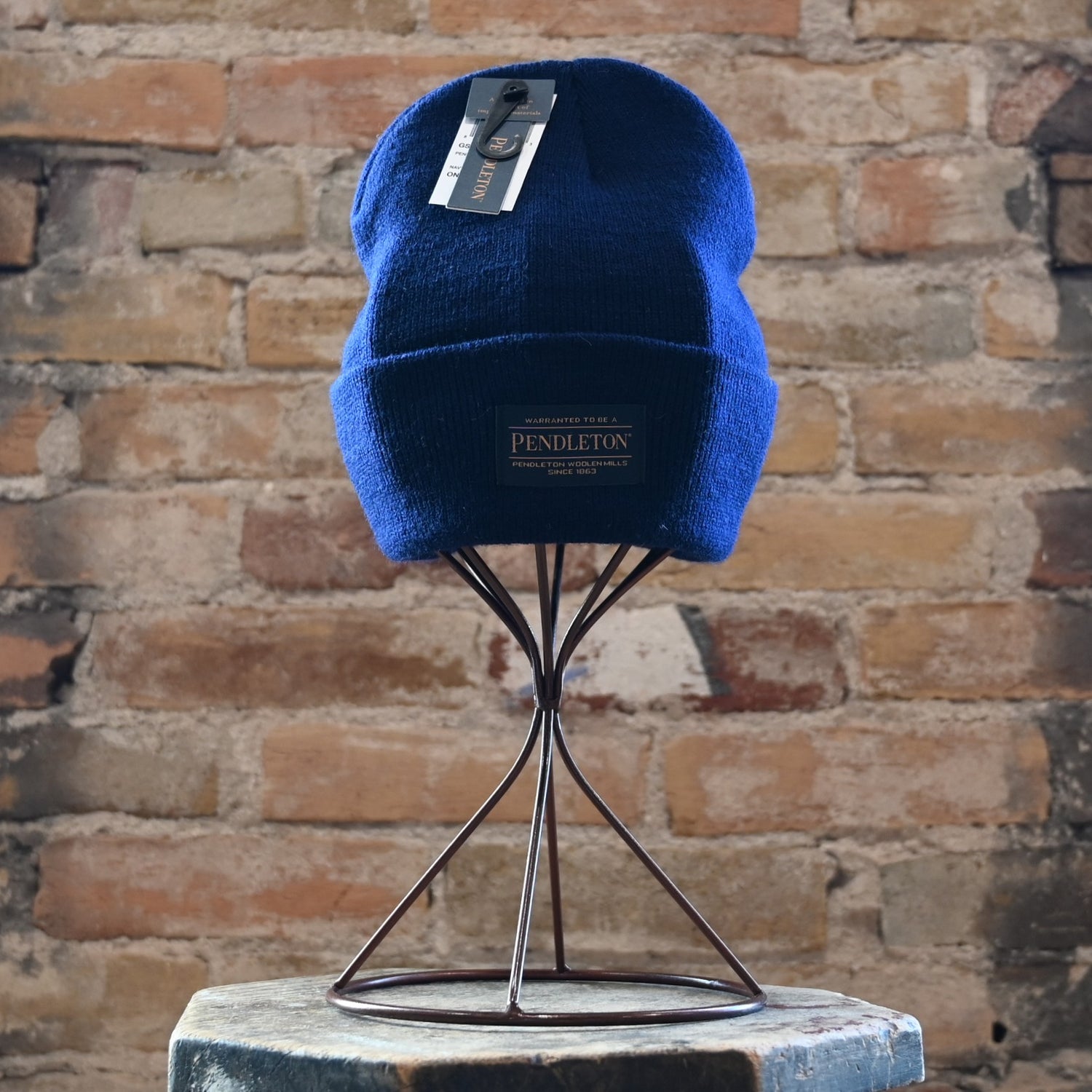 View of Pendleton unisex navy rib-knit wool beanie with fold-back brim and logo patch