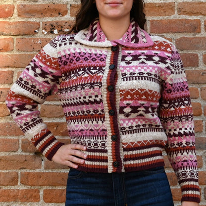 View of Filson Ladies Fair Isle Cardigan in Burgundy/Cream/Mauve featuring Western motifs and vertical-entry front pockets