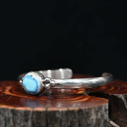 View of Sunwest Silver Paul Livingston Golden Hills One Stone Cuff featuring a light blue Golden Hills turquoise stone set in sterling silver