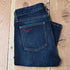 View of Kimes Ranch Chloe Jeans in Blue, featuring a mid-rise waist, fitted thigh, and flare bootcut leg with hand-sanded details