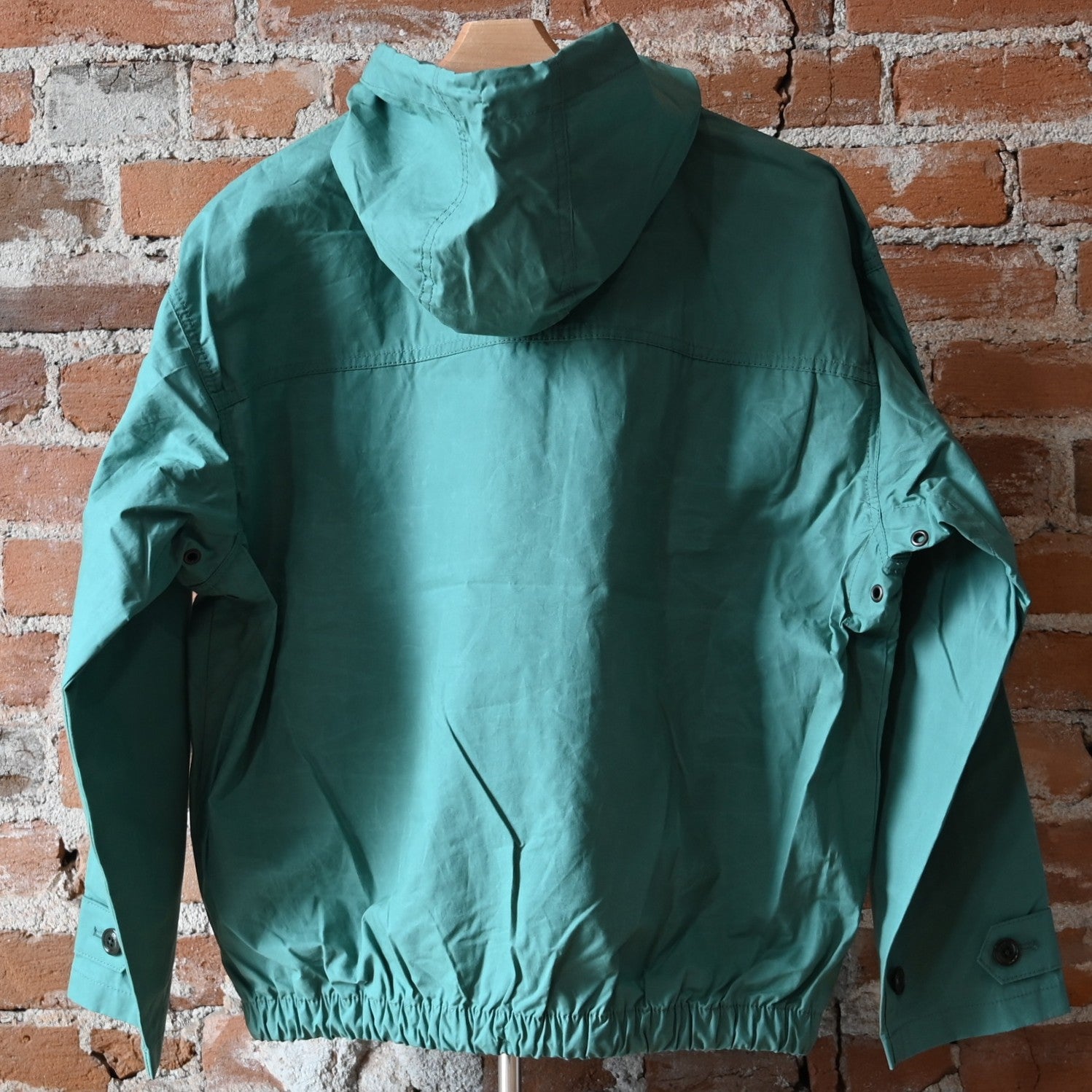 View of Filson Ladies Ranger Hooded Popover in Deep Sea featuring adjustable hood, cuffs, and separated hand pockets