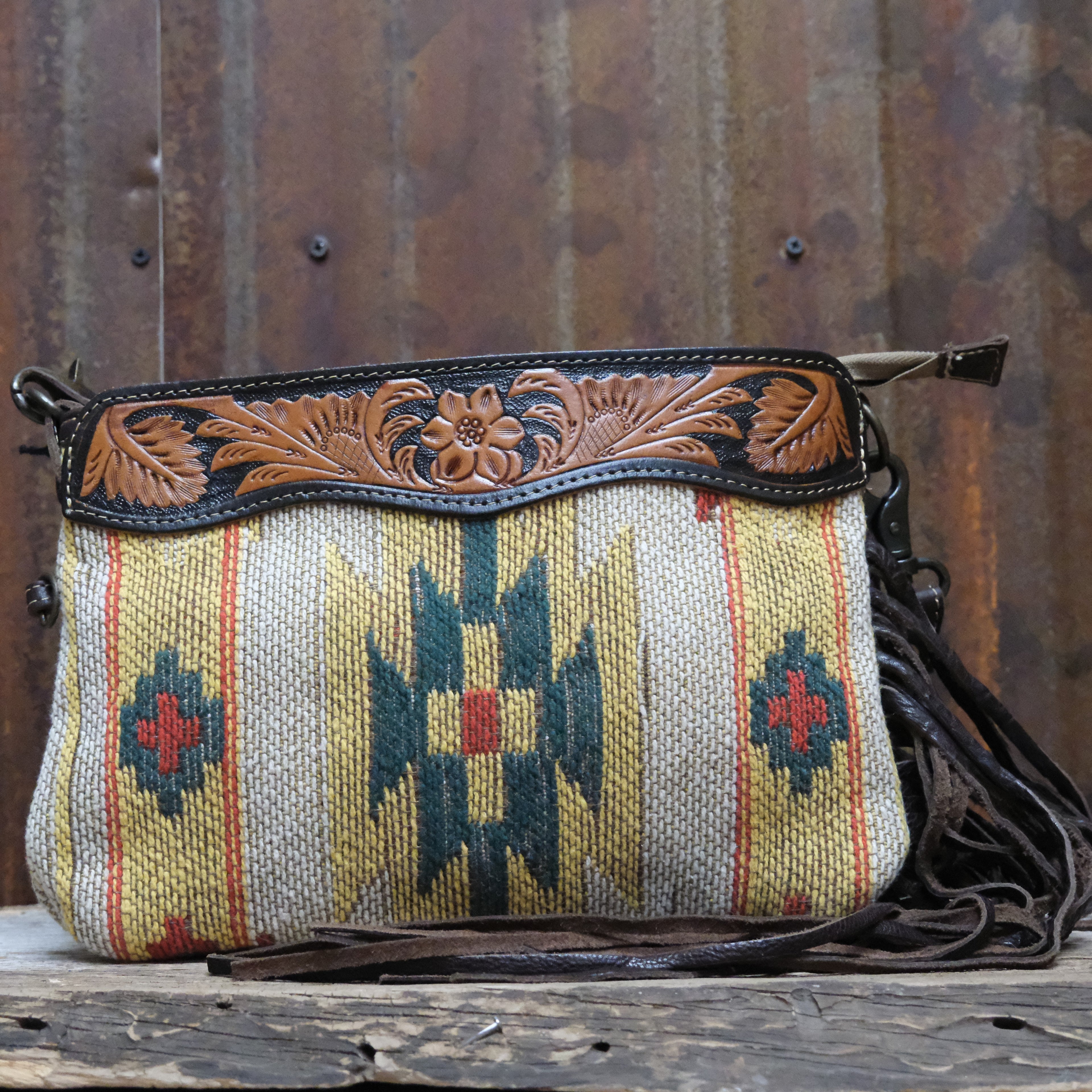 Myra yellow leather hand tooled bag with roomy interior and top closure