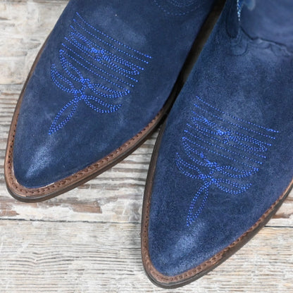 View of Macie Bean 15″ “Midnight In Paris” boot in marine blue suede with almond toe and cowgirl heel