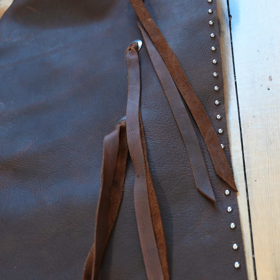 View of K Bar J Batwing Chap in size Large with rivets and a pocket