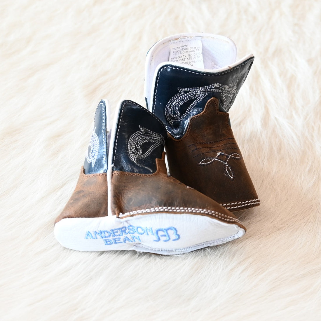 View of Anderson Bean Baby Bean boot with tan Crazy Horse vamp, navy glove top, and DB square toe