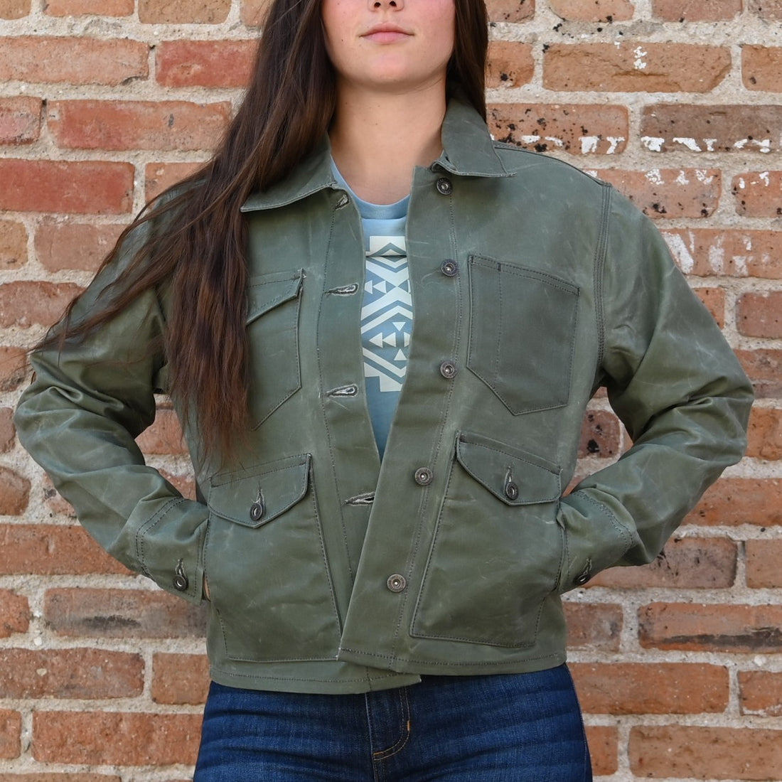 View of Schaefer ladies moss waxed canvas jacket with antique brass snaps and six pockets