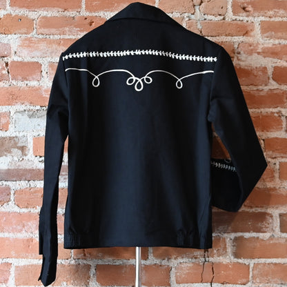 View of Rockmount vintage black gabardine bolero jacket with embroidery and snaps