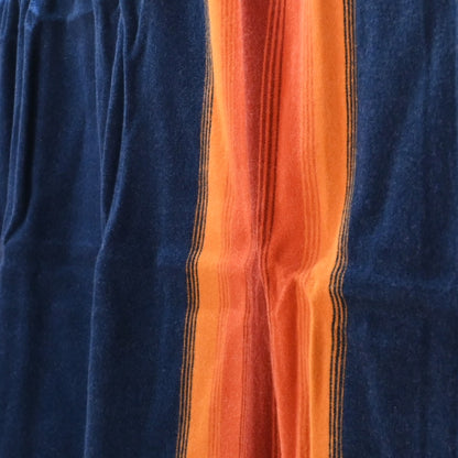 View of Pendleton National Park Blanket in Grand Canyon Navy with heritage stripes and park label