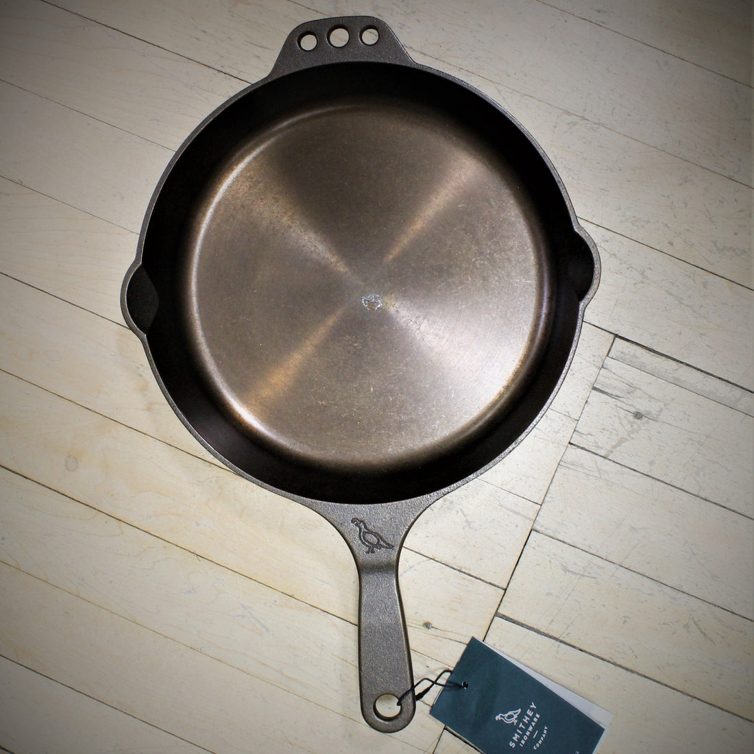 View of Smithey Ironware No. 10 Cast Iron Skillet with polished interior and ergonomic handle