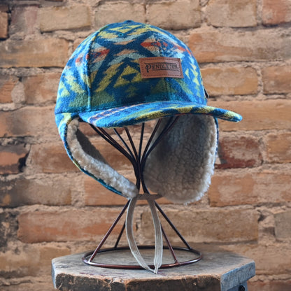 View of Pendleton Diamond Desert wool cap with sherpa ear flaps and tie closure