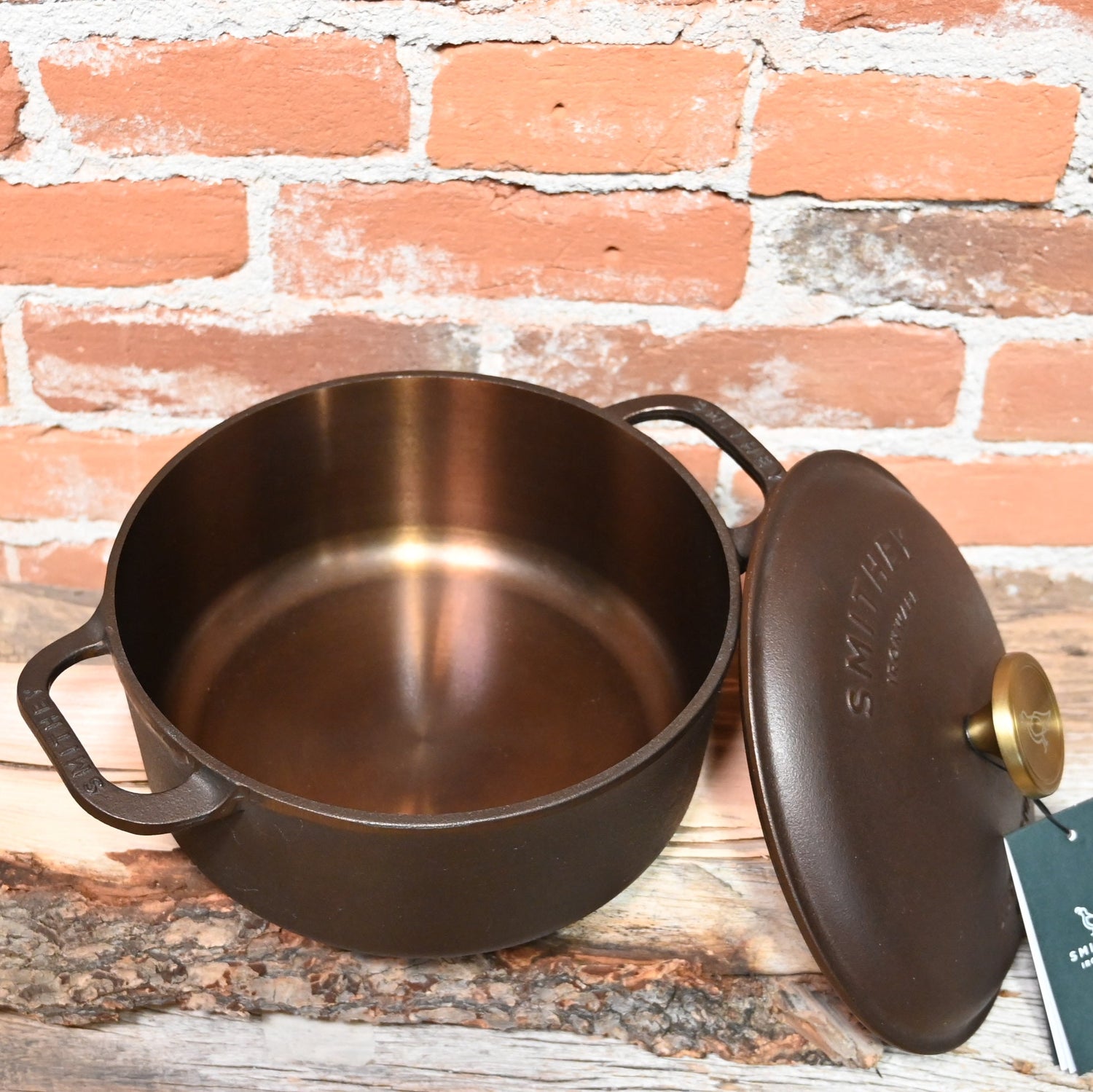 View of Smithey Ironware 5.5 qt Dutch Oven with polished interior and ergonomic handles