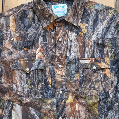 Sendero Confluence Tech Long Sleeve Shirt in Will Tree Camo featuring classic pearl snaps and a tailored western fit.