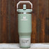 Stanley 30 oz IceFlow 2.0 Flip Straw Tumbler in Lichen green with handle and straw lid.