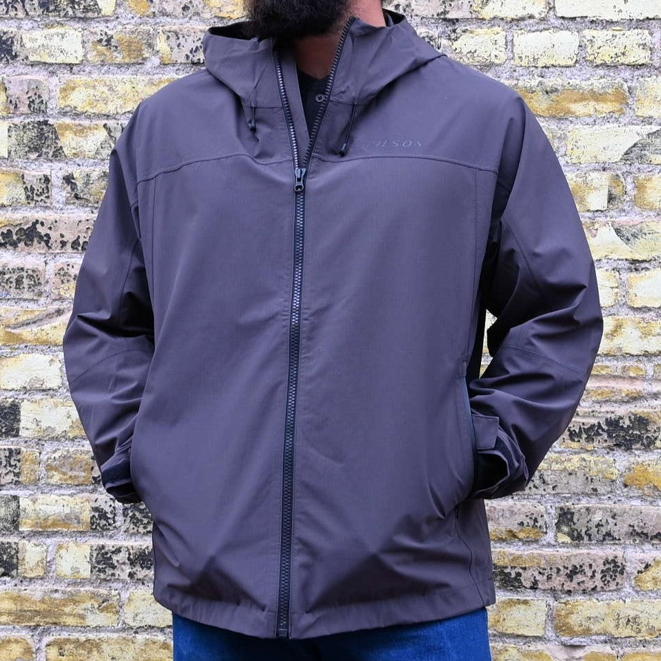 View of Filson Swiftwater Rain Jacket in Raven, showcasing its lightweight design and adjustable features