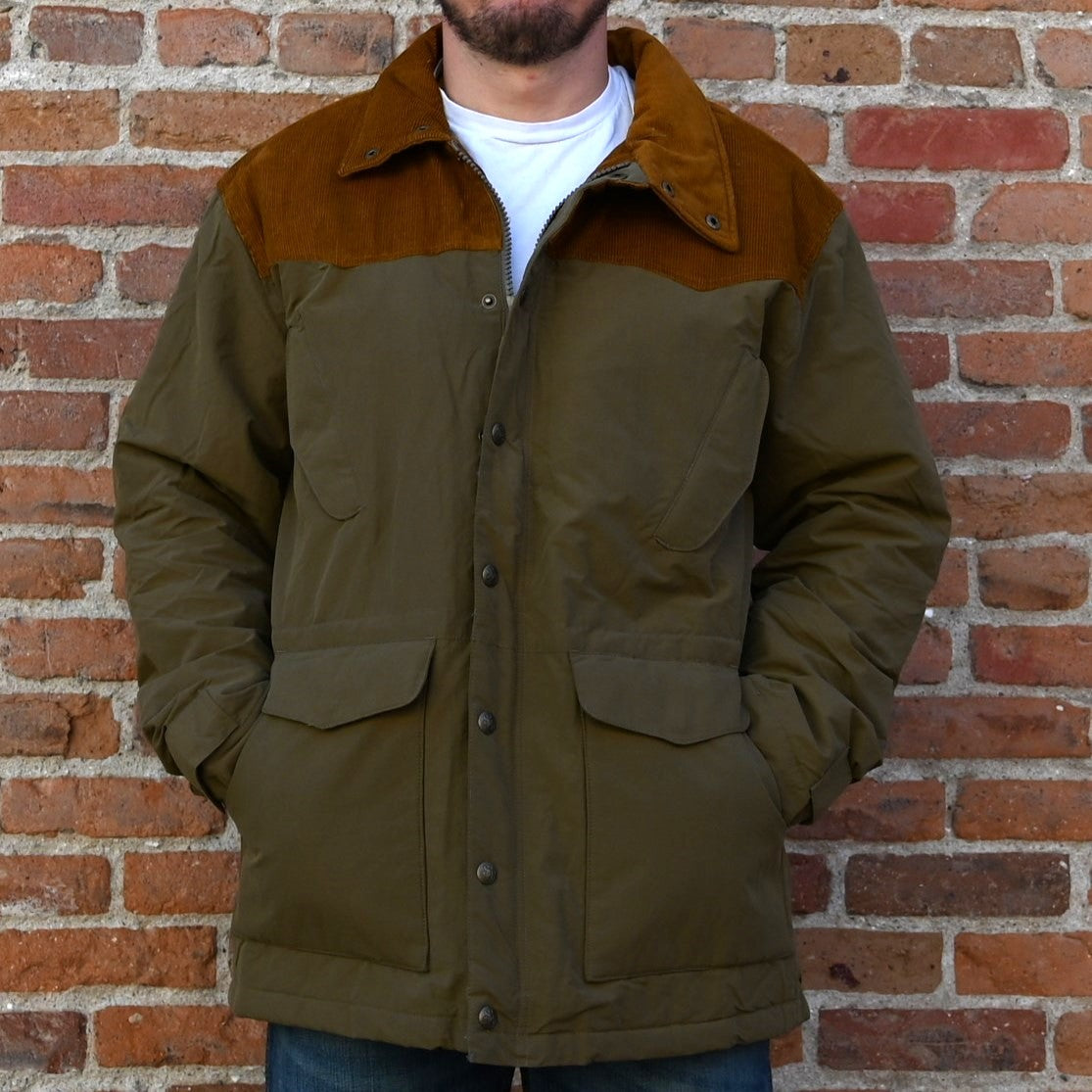 View of Schaefer Carson olive jacket with corduroy yoke and collar, quilted lining, and multiple utility pockets