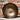 View of Smithey Ironware Carbon Steel Wok with hand-hammered surface and gooseneck handle
