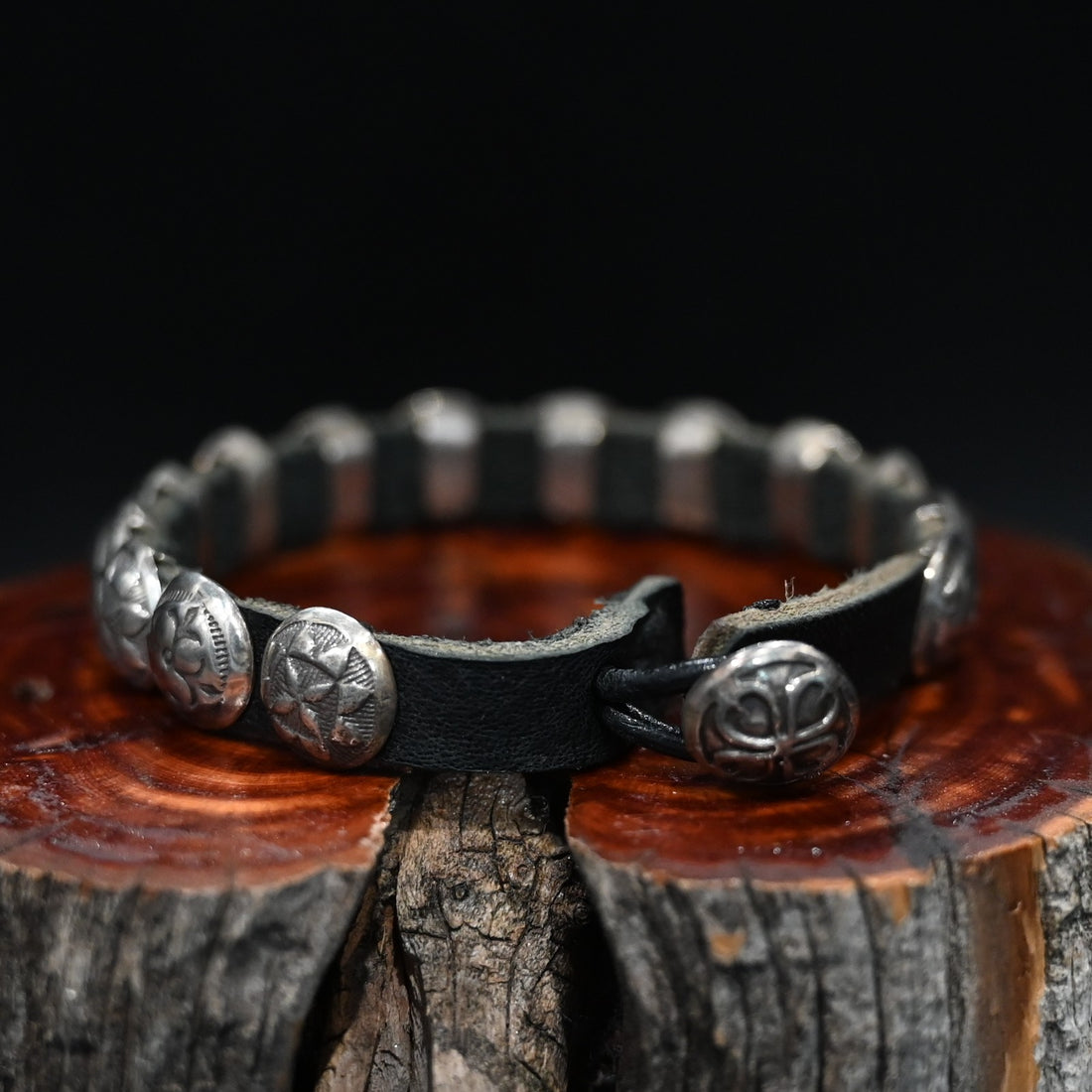 View of Sunwest Silver Leather Concho Bracelet featuring leather strap with sterling silver conchos and a concho clasp