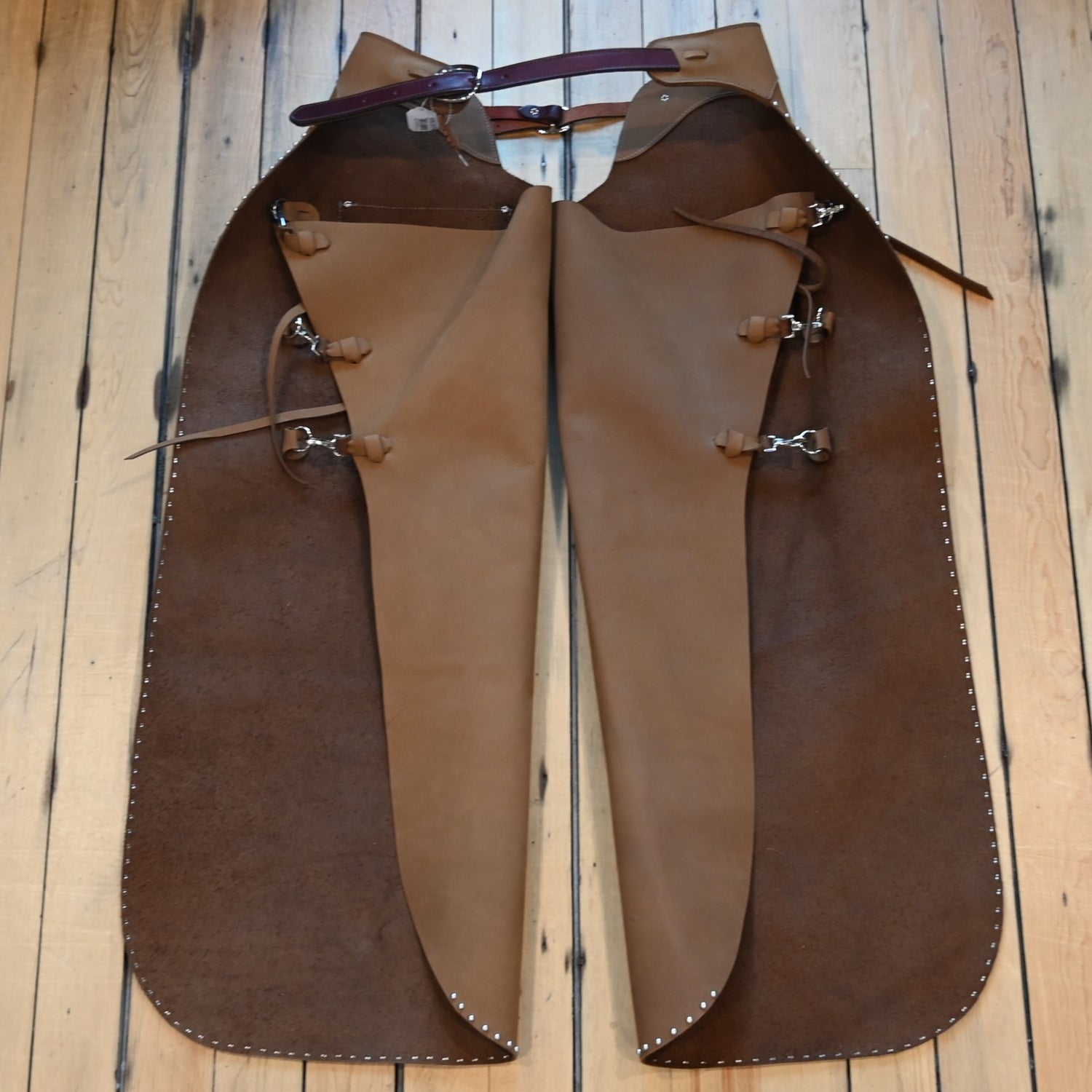 View of K Bar J Batwing Chap in size Medium with rivets and a pocket