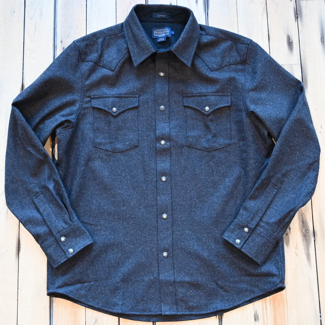 View of Pendleton men’s Canyon shirt in black and brown wool mix with snap front and Western details