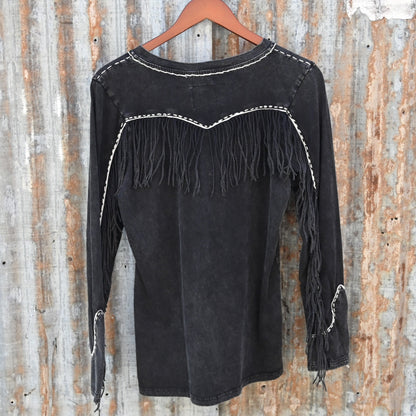 View of Double D Ranch Wild Like the West Tee featuring bold graphic and fringe detailing on long sleeves