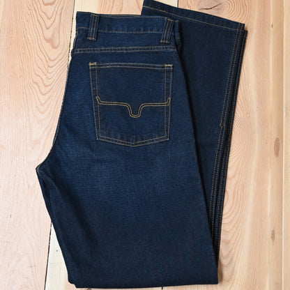 View of Kimes Ranch Watson jeans in Dark Indigo featuring hand-sanded details and bootcut leg