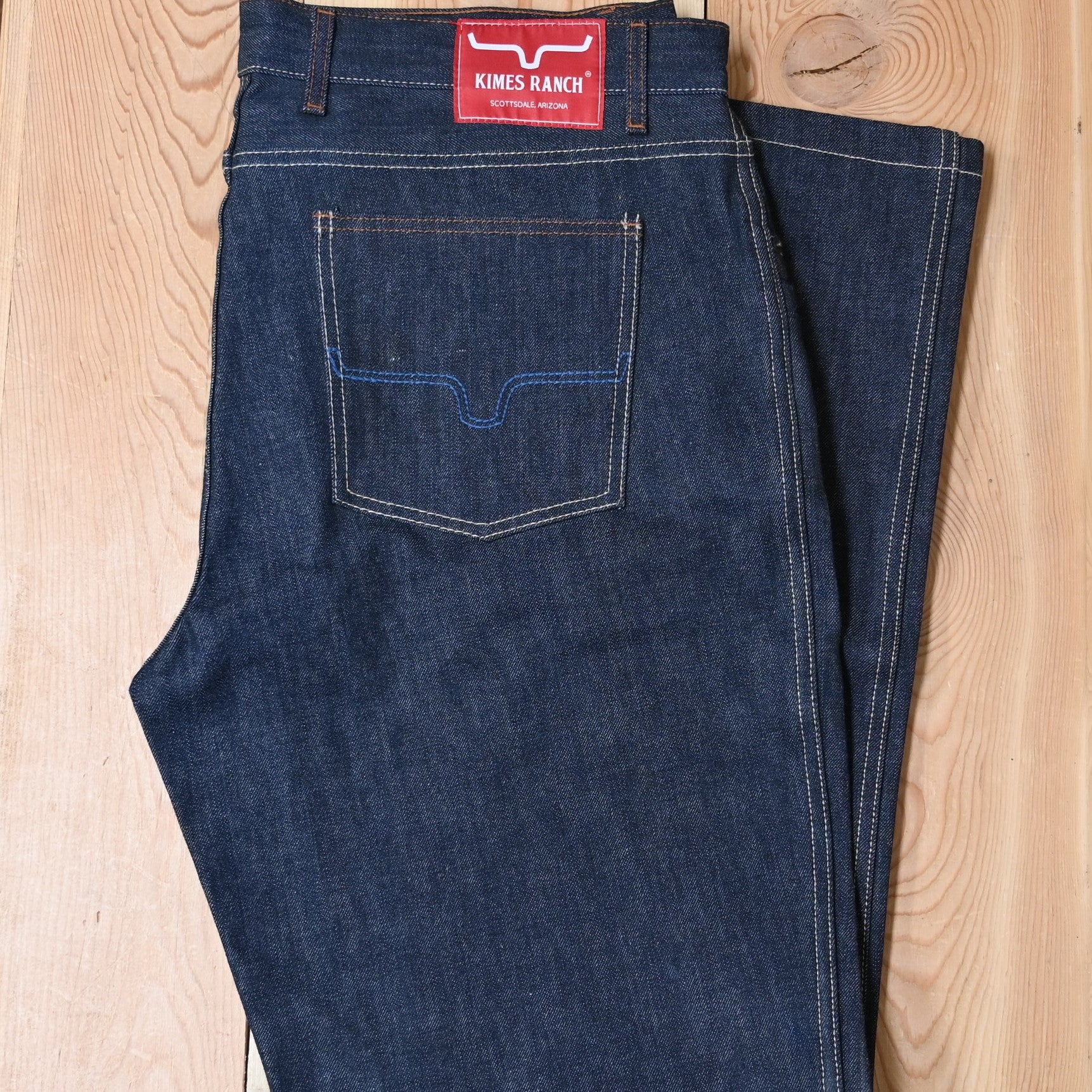 View of Kimes Ranch Raw Dillon Jeans in Indigo featuring off-white stitching and integrated knife pocket