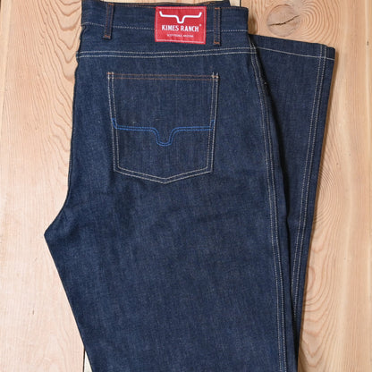View of Kimes Ranch Raw Dillon Jeans in Indigo featuring off-white stitching and integrated knife pocket