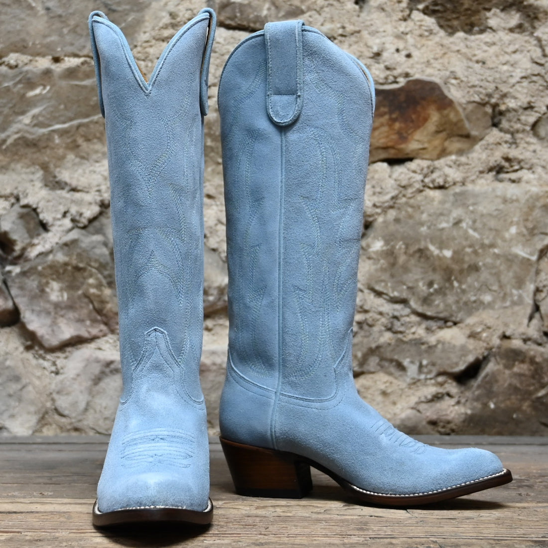 View of Macie Bean 15" baby blue suede boot with almond toe and cowgirl heel
