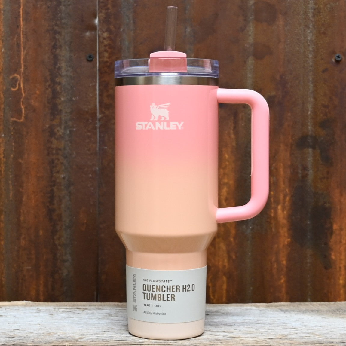 Stanley 40oz Quencher 2.0 FlowState tumbler in Mesa Sunset gradient with handle and straw.