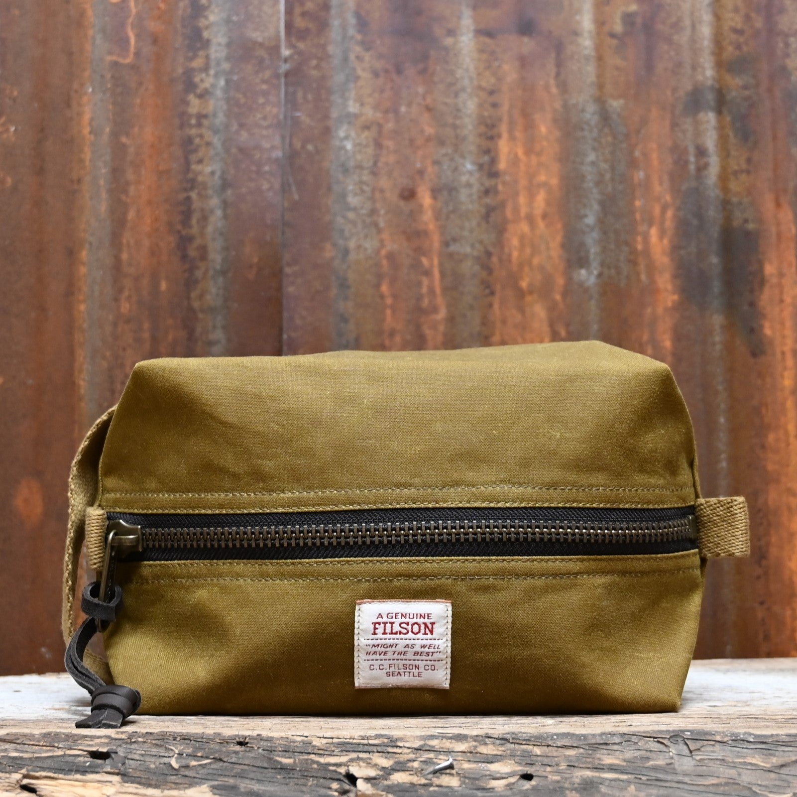 View of Filson Tin Cloth Travel Kit in Dark Tan, showcasing durable waxed cotton exterior and practical design for travel essentials
