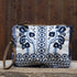 Myra artisanal blue embroidered canvas pouch with leather trim and zipper closure